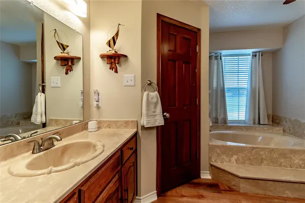 a bathroom with a bathtub and shower