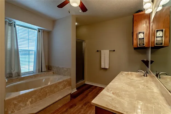 a bathroom with a sink a vanity and a mirror