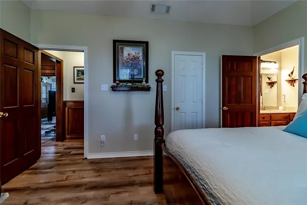 a bedroom with a bed and a couch