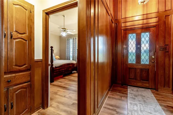 a living room with furniture a lamp and a window