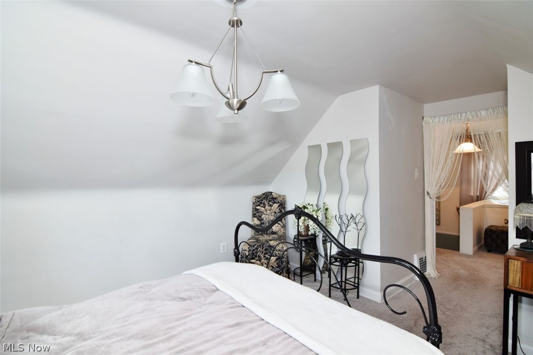 3451 Edison Road Cleveland Heights, OH 44121 - Photo 38 of 46 Sloped ceiling with an attached chandelier