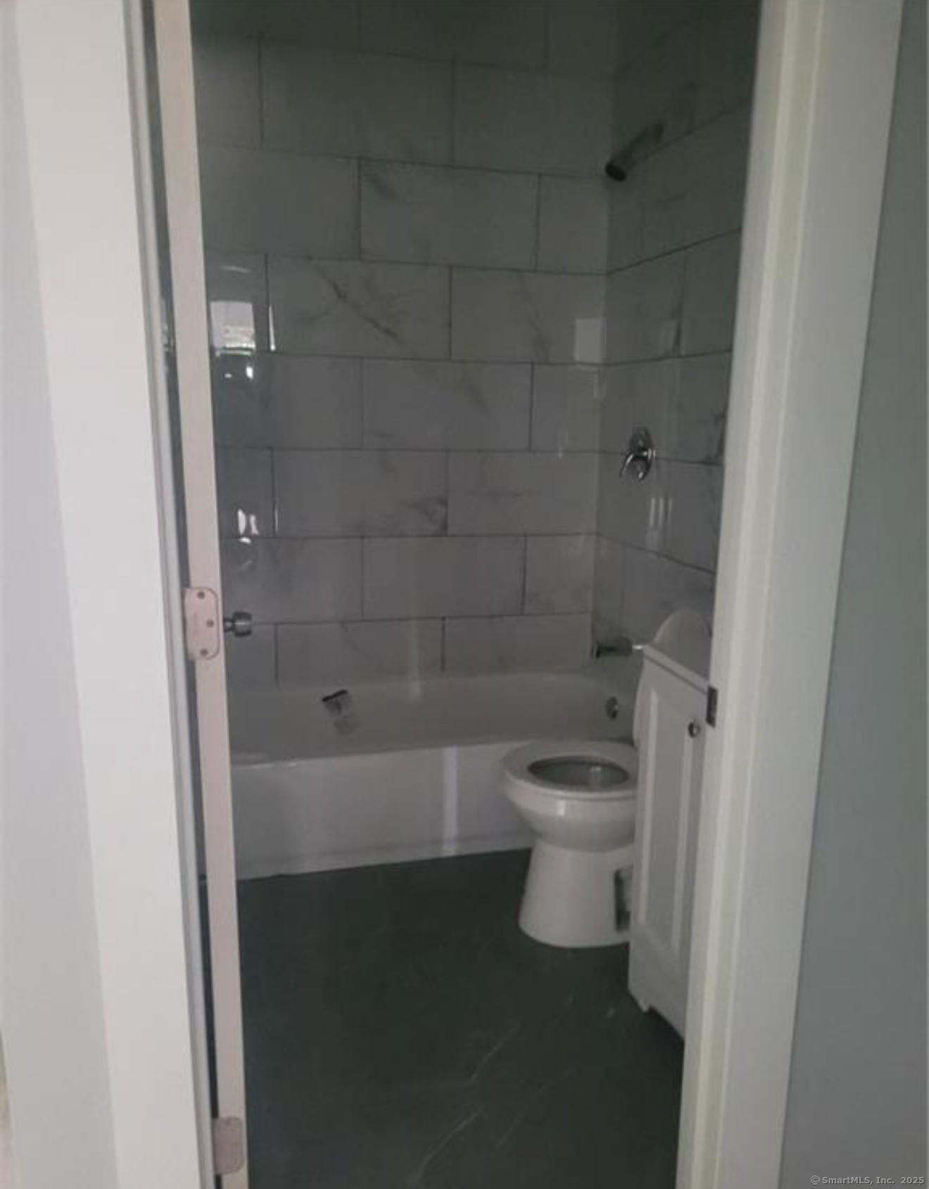 286 Gregory Street, Unit 2R Bridgeport, CT 06604 - Photo 2 of 2 a bathroom with a toilet and a shower