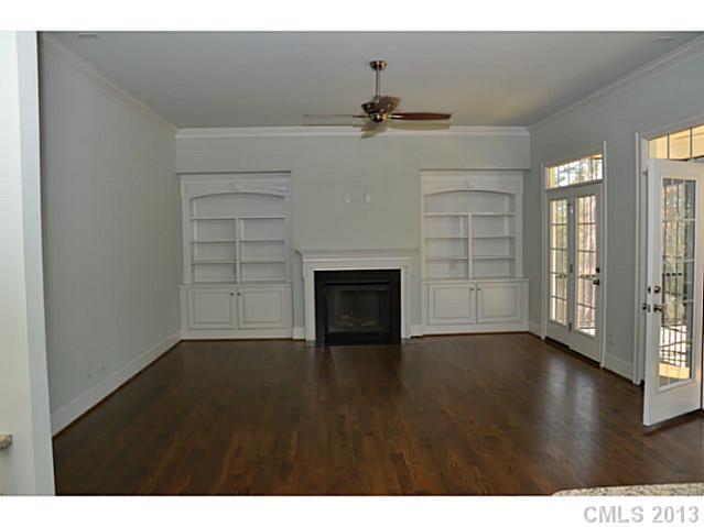 361 Olmstead Street Fort Mill, SC 29708 - Photo 6 of 16 a view of an empty room with a fireplace and a window