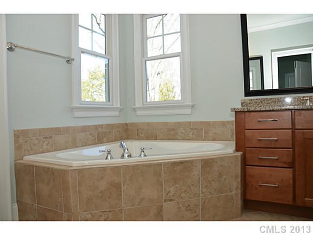 361 Olmstead Street Fort Mill, SC 29708 - Photo 7 of 16 a bathroom with a bathtub and a sink
