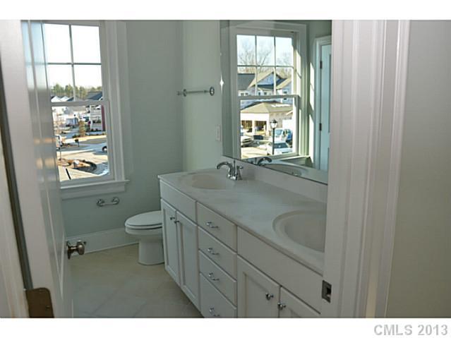 361 Olmstead Street Fort Mill, SC 29708 - Photo 9 of 16 a bathroom with a sink a toilet and a window
