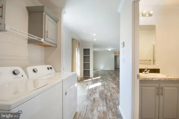 a view of a bathroom with a sink and mirror