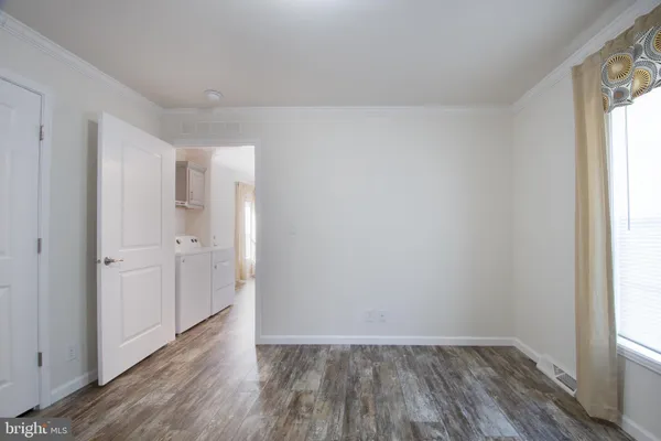 a view of an empty room and window