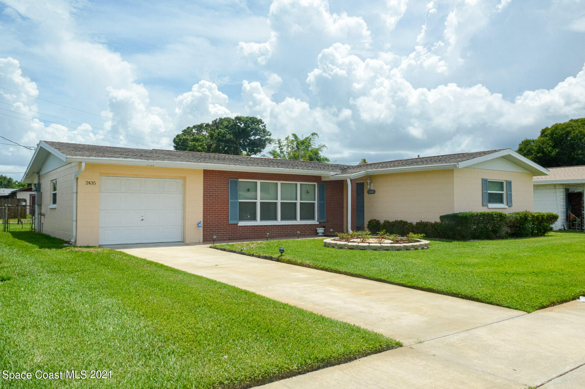 2435 Ricky Road Melbourne, FL 32935 - Photo 1 of 20 a view of a yard in front of a house