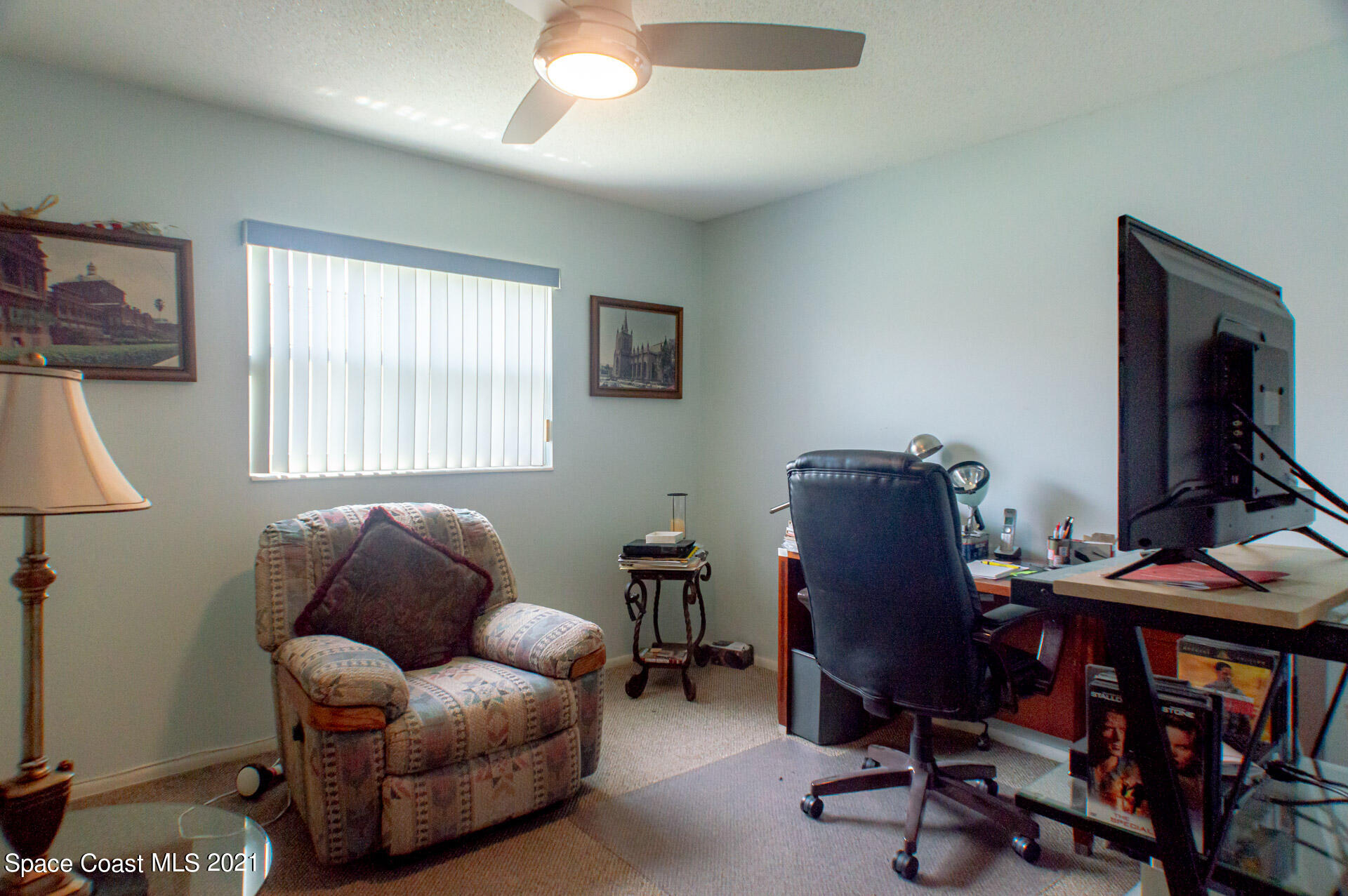2435 Ricky Road Melbourne, FL 32935 - Photo 13 of 20 a livingroom with workspace and a window