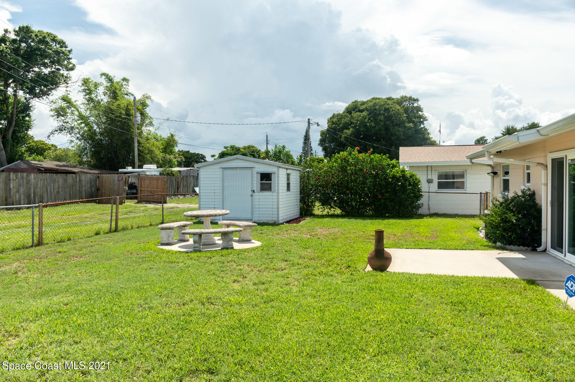2435 Ricky Road Melbourne, FL 32935 - Photo 18 of 20 a view of a backyard with swimming pool