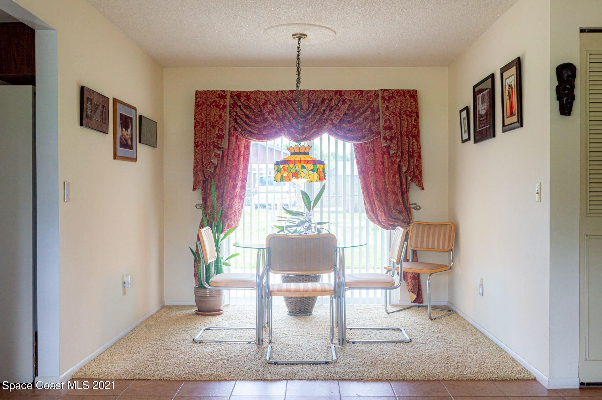 2435 Ricky Road Melbourne, FL 32935 - Photo 8 of 20 a living room with furniture and a table