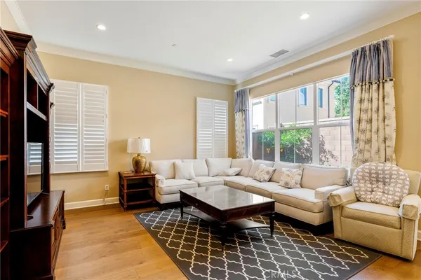 a living room with furniture or couch and a large window