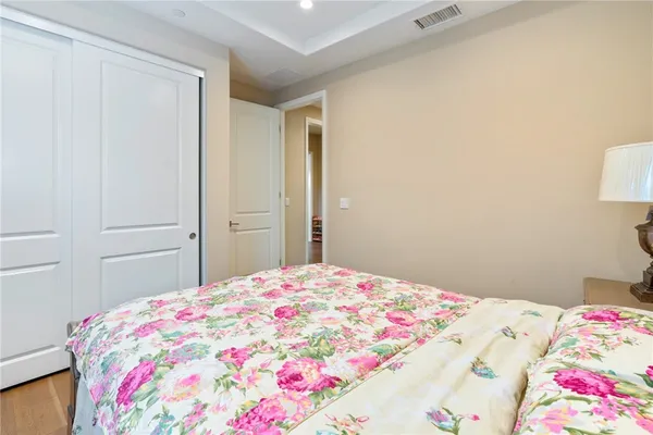 a bedroom with a bed and a closet