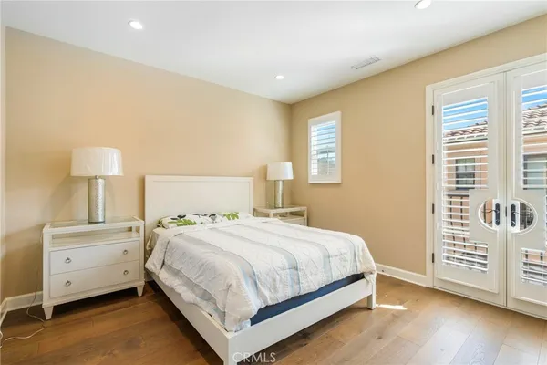 a bedroom with a bed and a lamp