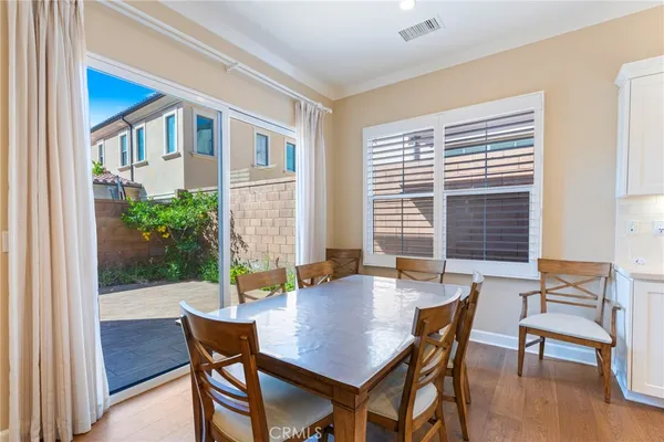 a view of a dining room with furniture and window