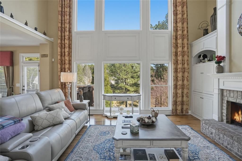 1915 Brackendale Road Northwest Kennesaw, GA 30152 - Photo 11 of 69 a living room with furniture fireplace and a large window