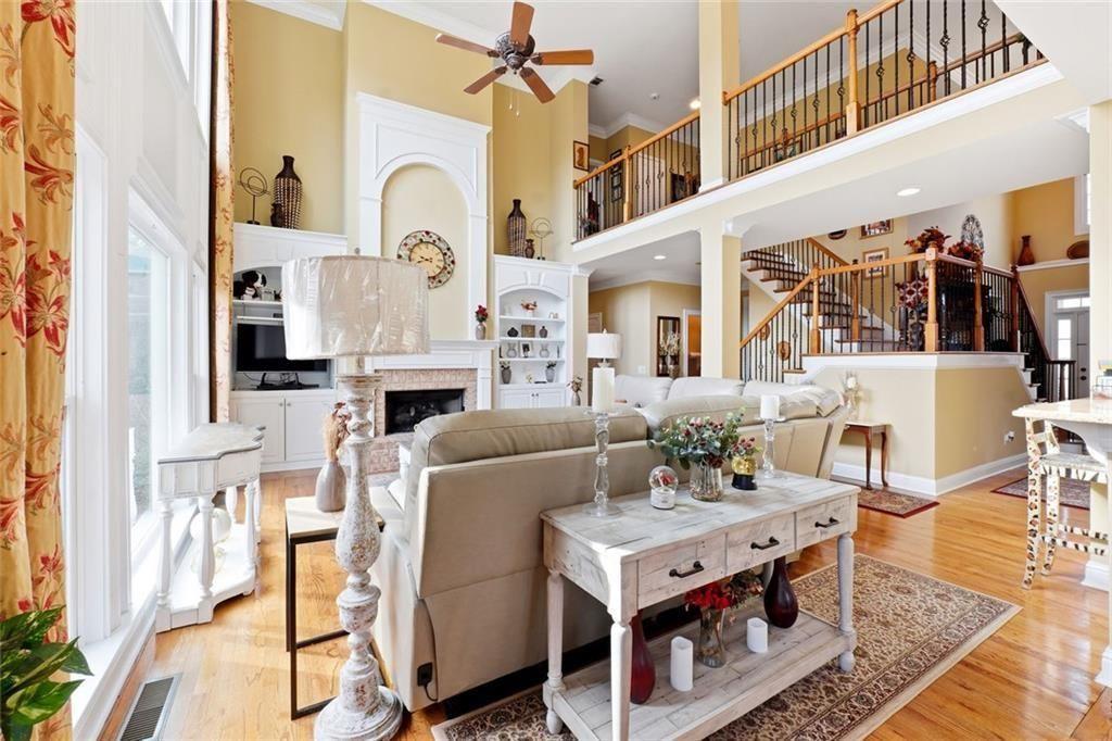 1915 Brackendale Road Northwest Kennesaw, GA 30152 - Photo 13 of 69 a living room with furniture a fireplace and a table