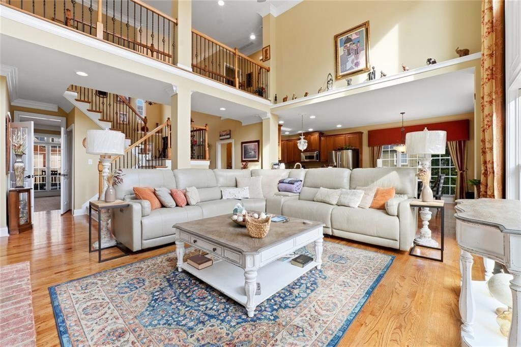 1915 Brackendale Road Northwest Kennesaw, GA 30152 - Photo 14 of 69 a living room with furniture a rug and a floor to ceiling window