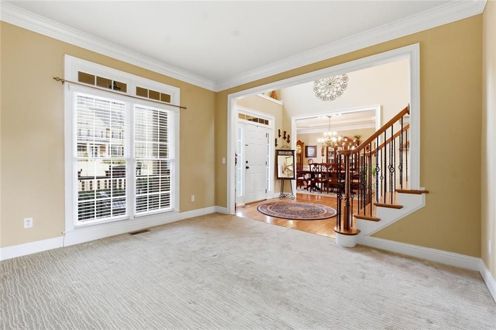 1915 Brackendale Road Northwest Kennesaw, GA 30152 - Photo 16 of 69 a view of empty room with wooden floor and windows