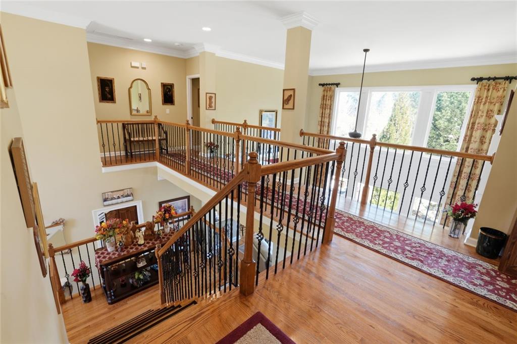 1915 Brackendale Road Northwest Kennesaw, GA 30152 - Photo 19 of 69 a view of a hallway with wooden floor and windows