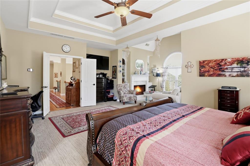 1915 Brackendale Road Northwest Kennesaw, GA 30152 - Photo 20 of 69 a bedroom with a bed and dresser with mirror