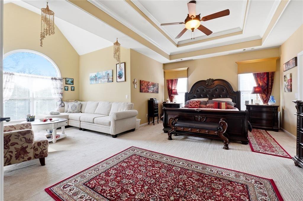 1915 Brackendale Road Northwest Kennesaw, GA 30152 - Photo 21 of 69 a living room with furniture a rug and a chandelier