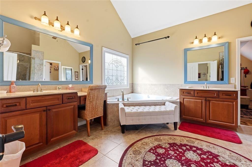 1915 Brackendale Road Northwest Kennesaw, GA 30152 - Photo 25 of 69 a spacious bedroom with a bed dresser and a window