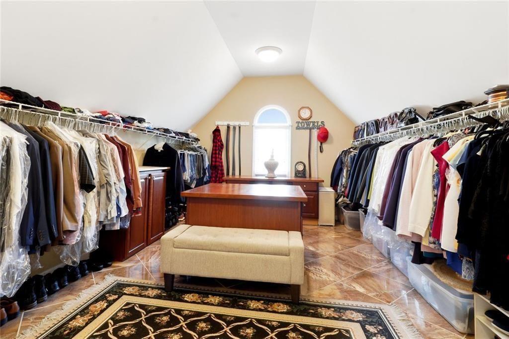 1915 Brackendale Road Northwest Kennesaw, GA 30152 - Photo 28 of 69 a view of walk in closet with clothes and shoes