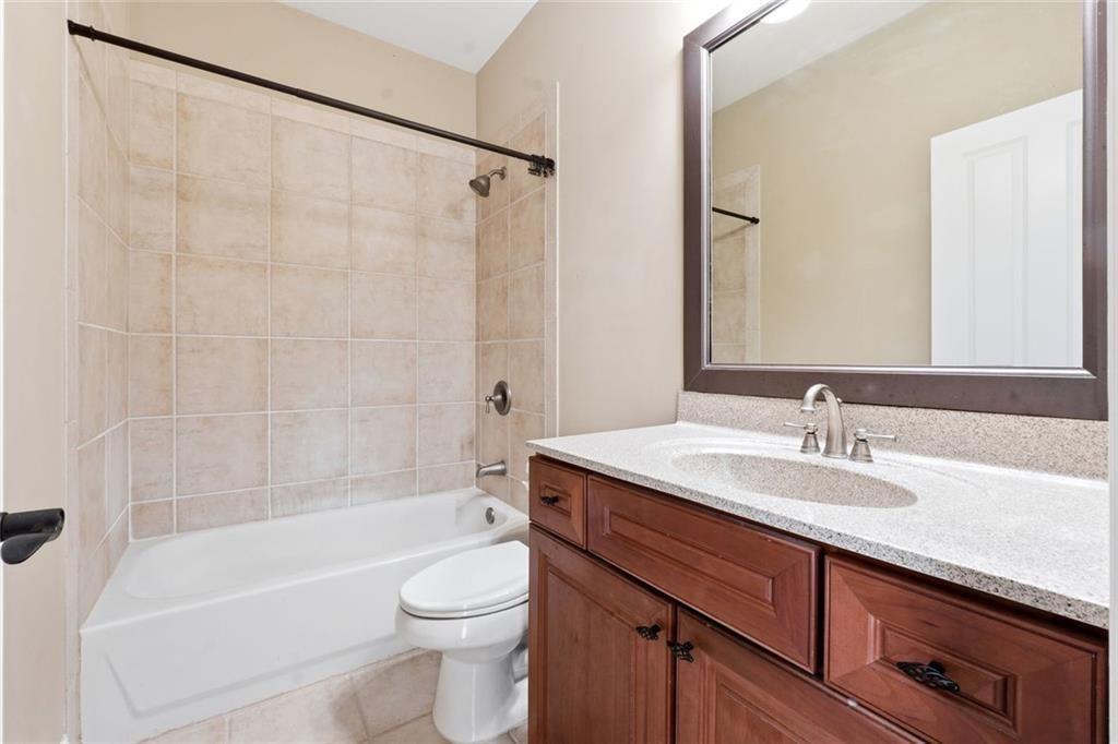 1915 Brackendale Road Northwest Kennesaw, GA 30152 - Photo 31 of 69 a bathroom with a sink a toilet and a bathtub