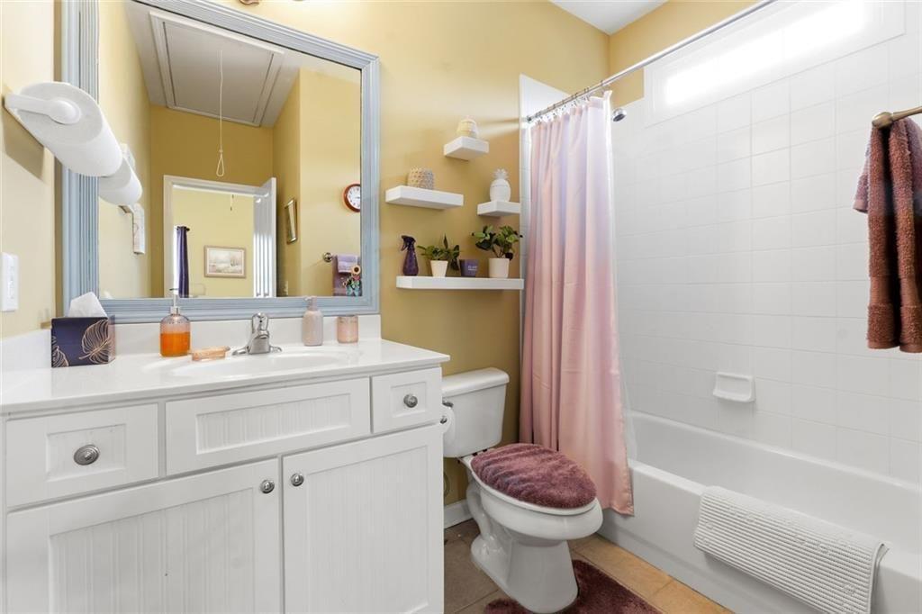 1915 Brackendale Road Northwest Kennesaw, GA 30152 - Photo 34 of 69 a bathroom with a sink a toilet and a bathtub