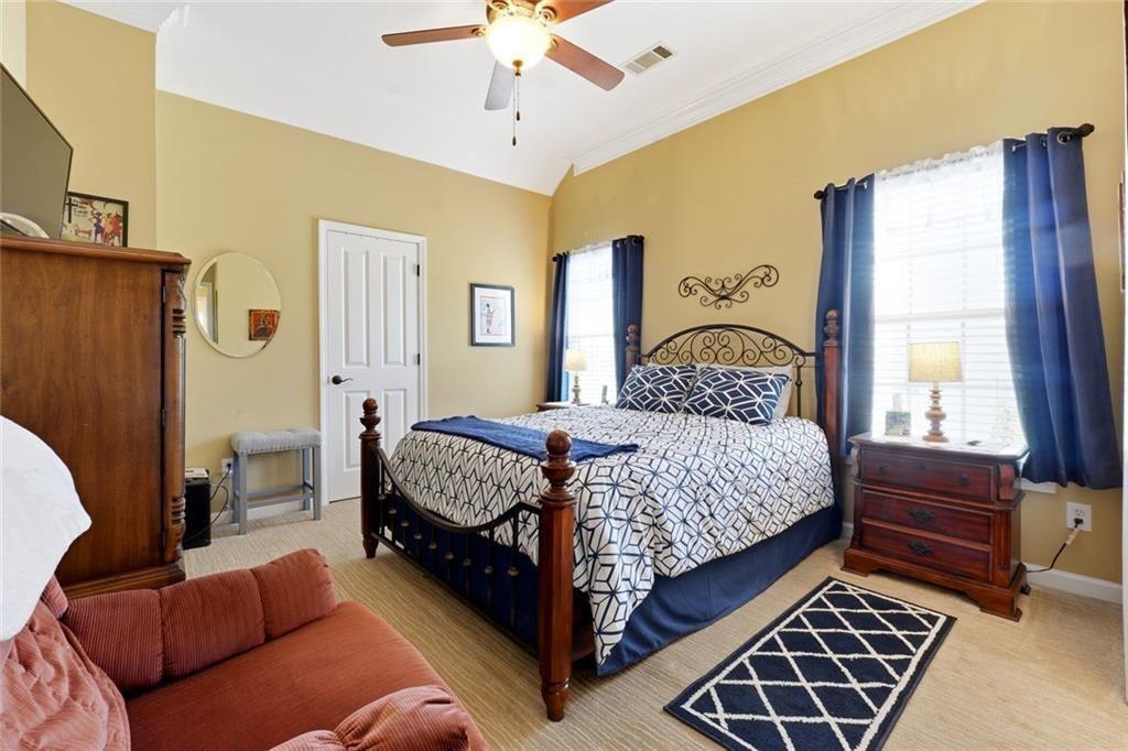 1915 Brackendale Road Northwest Kennesaw, GA 30152 - Photo 35 of 69 a bedroom with a bed and window