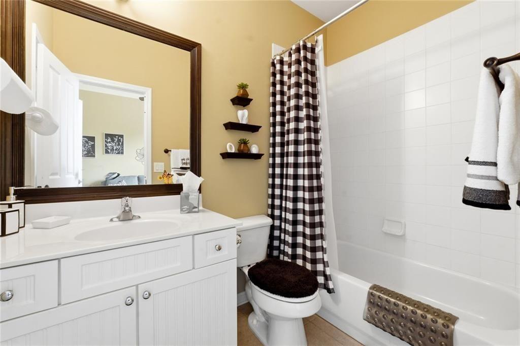 1915 Brackendale Road Northwest Kennesaw, GA 30152 - Photo 39 of 69 a bathroom with a sink toilet and shower