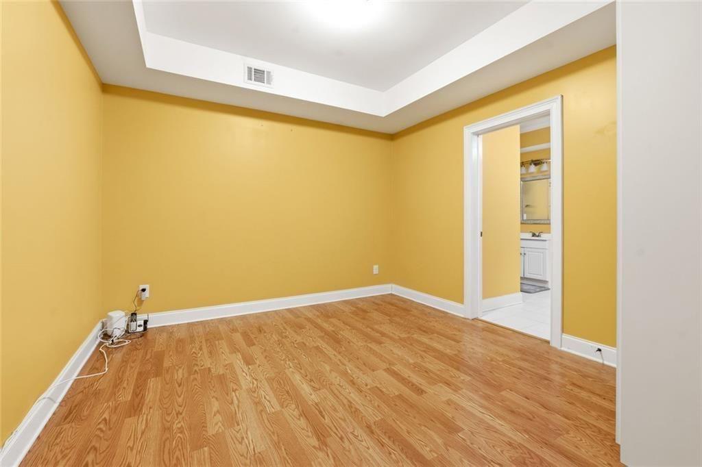 1915 Brackendale Road Northwest Kennesaw, GA 30152 - Photo 40 of 69 a view of a big room with wooden floor and windows