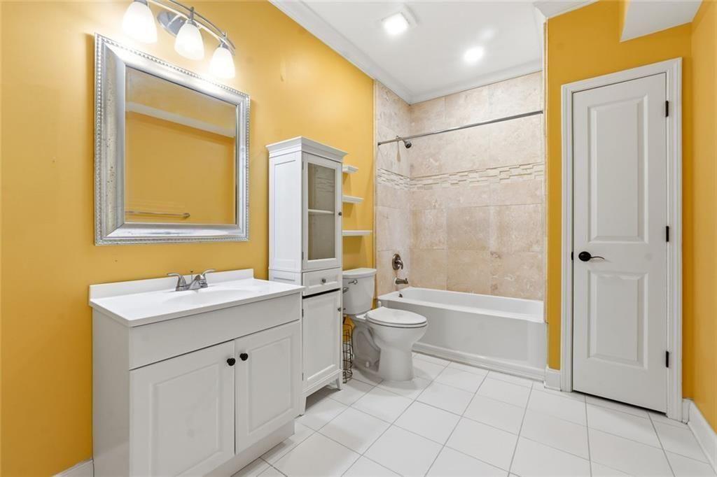 1915 Brackendale Road Northwest Kennesaw, GA 30152 - Photo 43 of 69 a bathroom with a sink toilet and shower