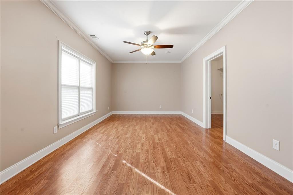 1915 Brackendale Road Northwest Kennesaw, GA 30152 - Photo 44 of 69 wooden floor in an empty room with a window