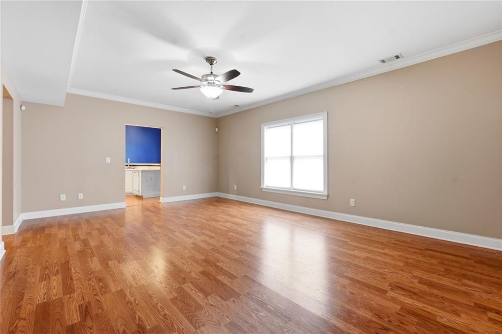1915 Brackendale Road Northwest Kennesaw, GA 30152 - Photo 47 of 69 a view of empty room with wooden floor and fan