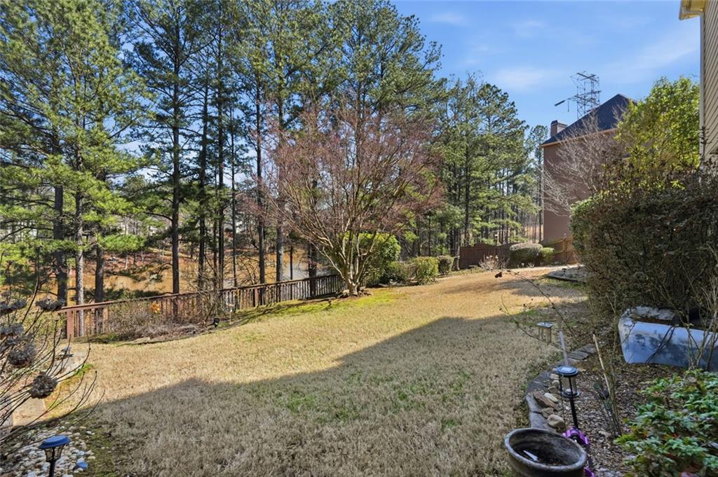 1915 Brackendale Road Northwest Kennesaw, GA 30152 - Photo 56 of 69 a view of a yard with plants and trees