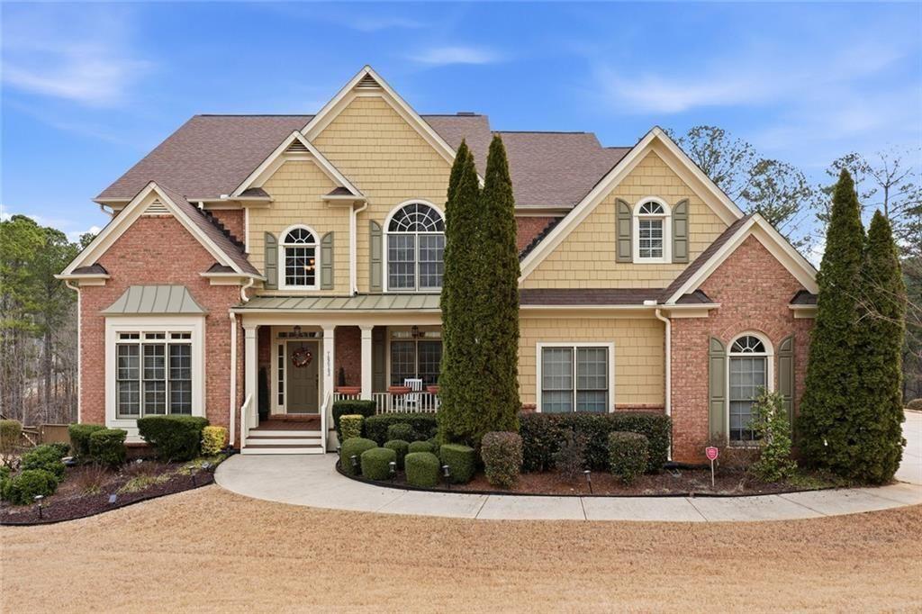 1915 Brackendale Road Northwest Kennesaw, GA 30152 - Photo 58 of 69 a view of a brick house with a yard