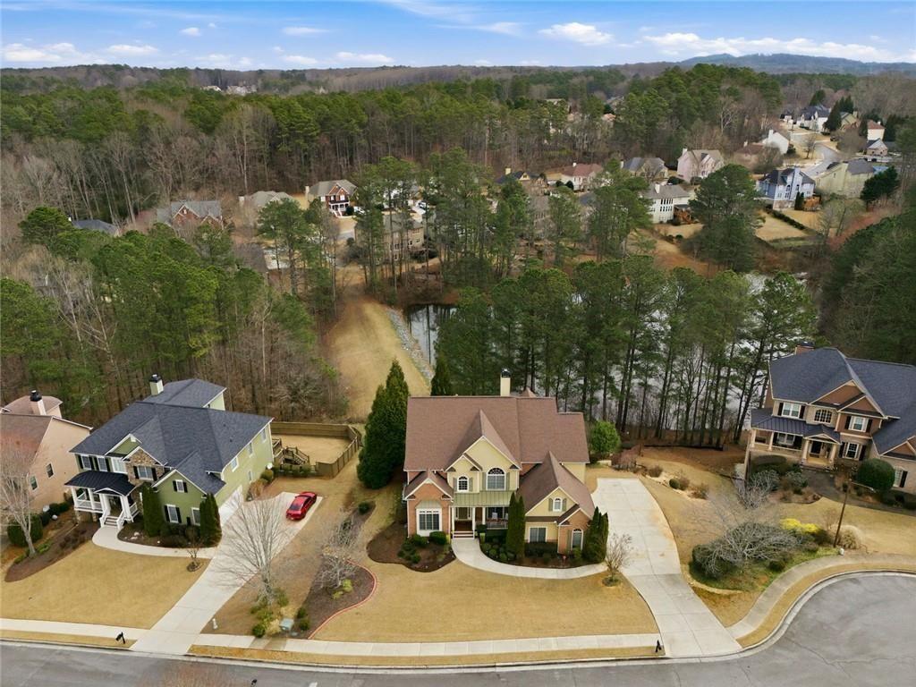 1915 Brackendale Road Northwest Kennesaw, GA 30152 - Photo 61 of 69 a view of a terrace with a table and chairs
