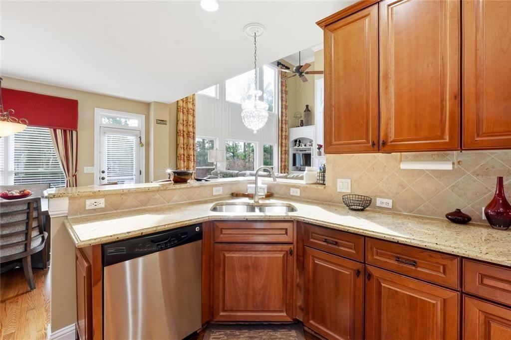 1915 Brackendale Road Northwest Kennesaw, GA 30152 - Photo 7 of 69 a kitchen with stainless steel appliances sink cabinets and window