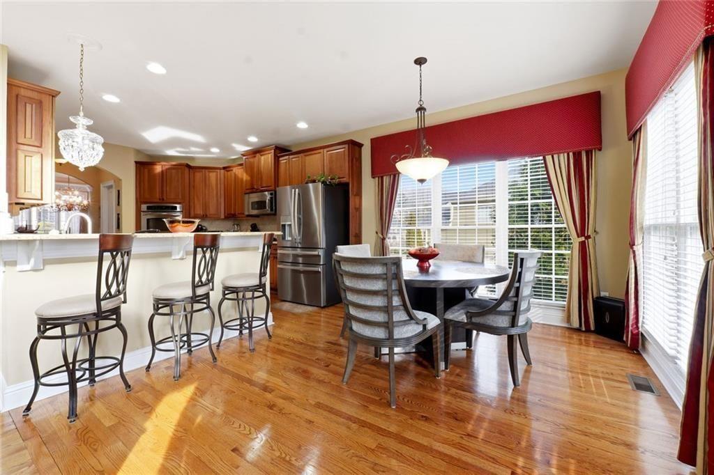 1915 Brackendale Road Northwest Kennesaw, GA 30152 - Photo 9 of 69 a view of a dining room with furniture window and wooden floor