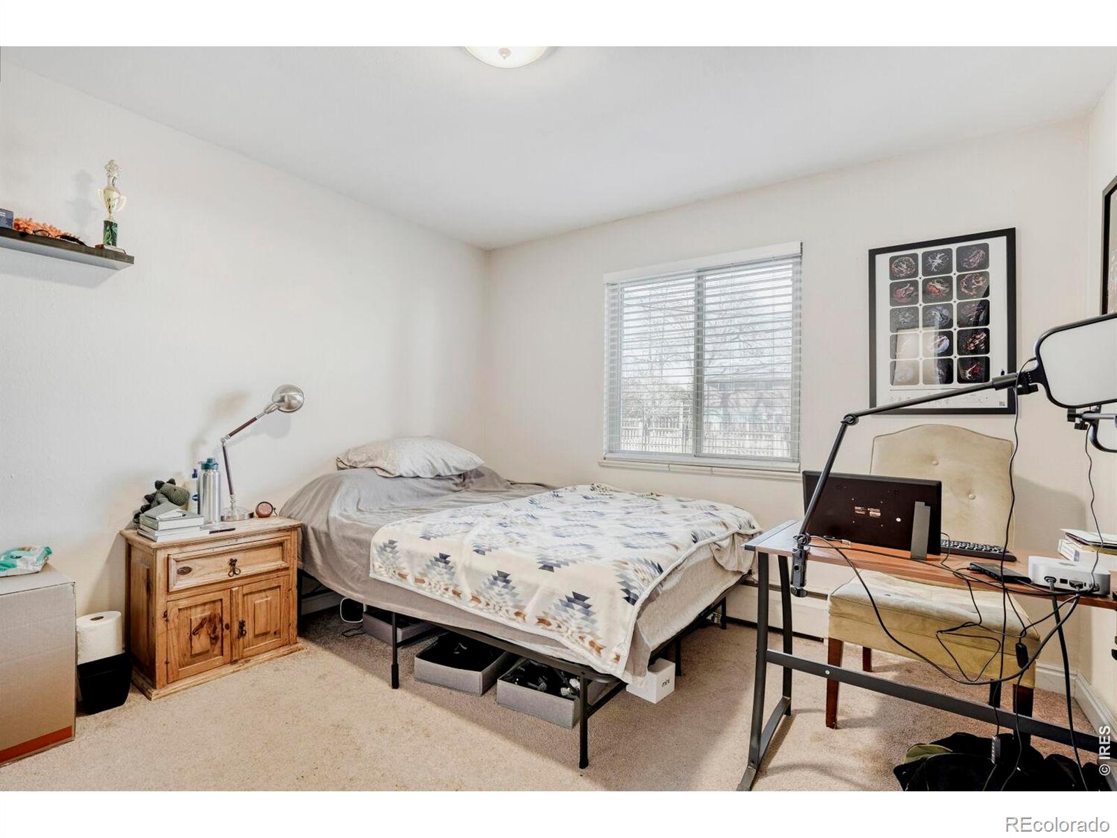 1895 Alpine Avenue, Unit G22 Boulder, CO 80304 - Photo 17 of 33 a bedroom with furniture and a window