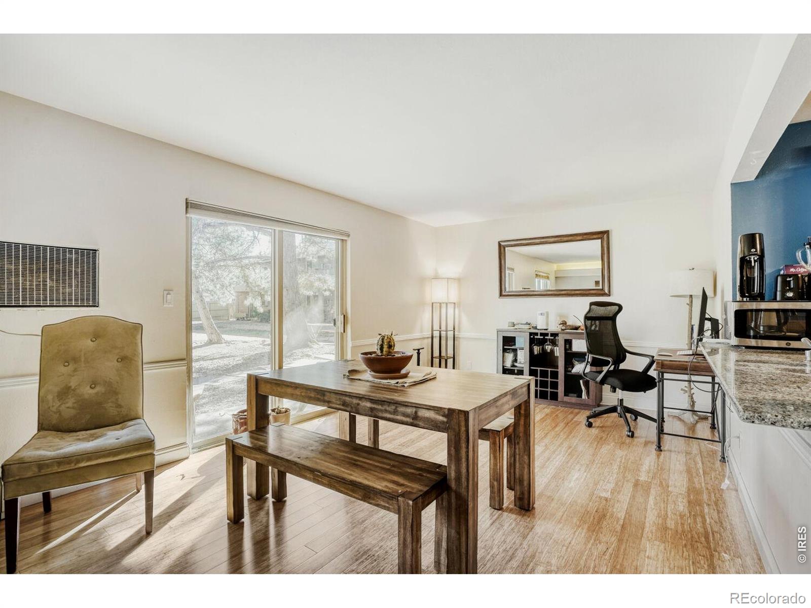 1895 Alpine Avenue, Unit G22 Boulder, CO 80304 - Photo 2 of 33 a living room with furniture and a wooden floor