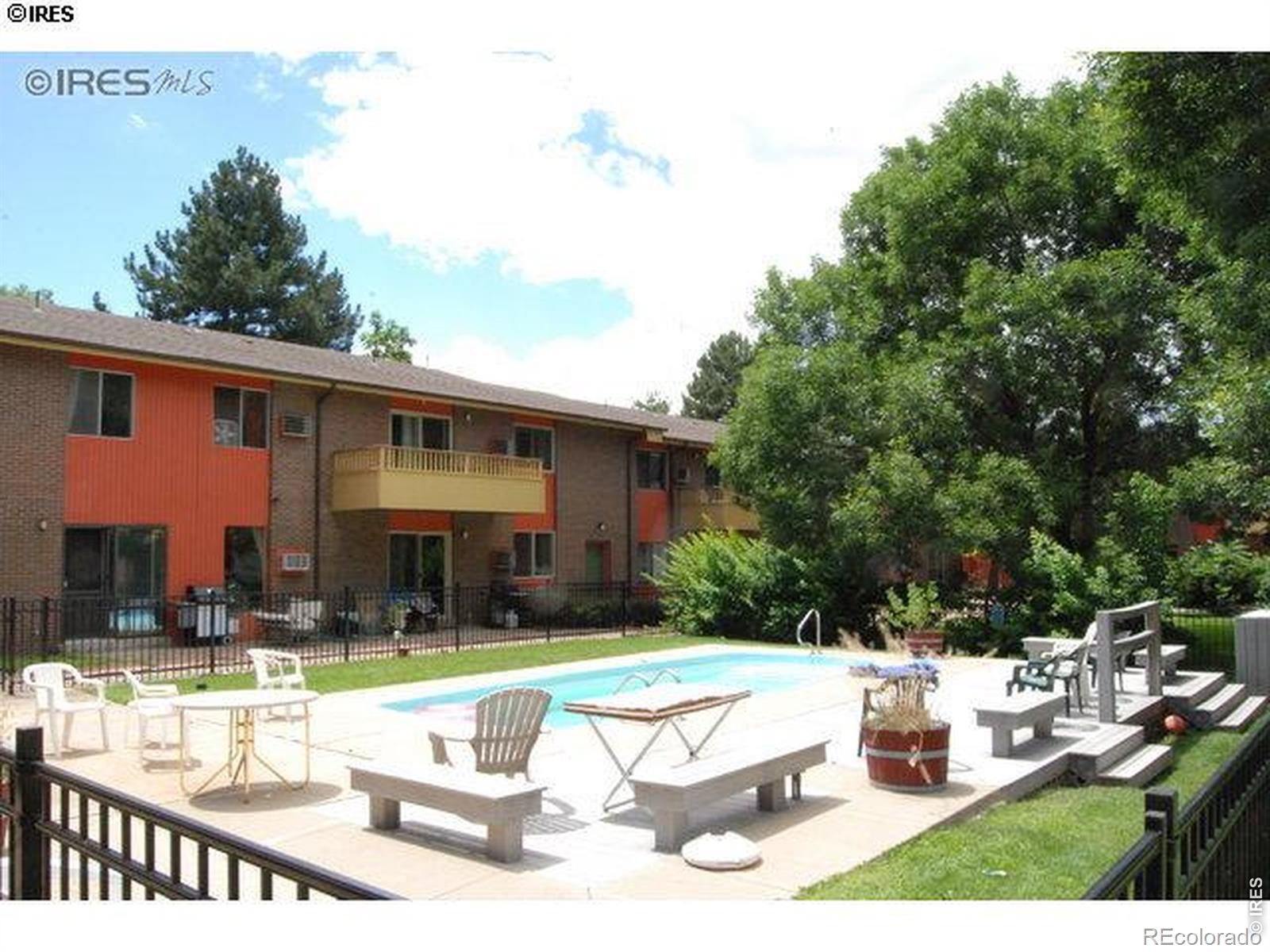 1895 Alpine Avenue, Unit G22 Boulder, CO 80304 - Photo 23 of 33 a view of a house with backyard sitting area and swimming pool