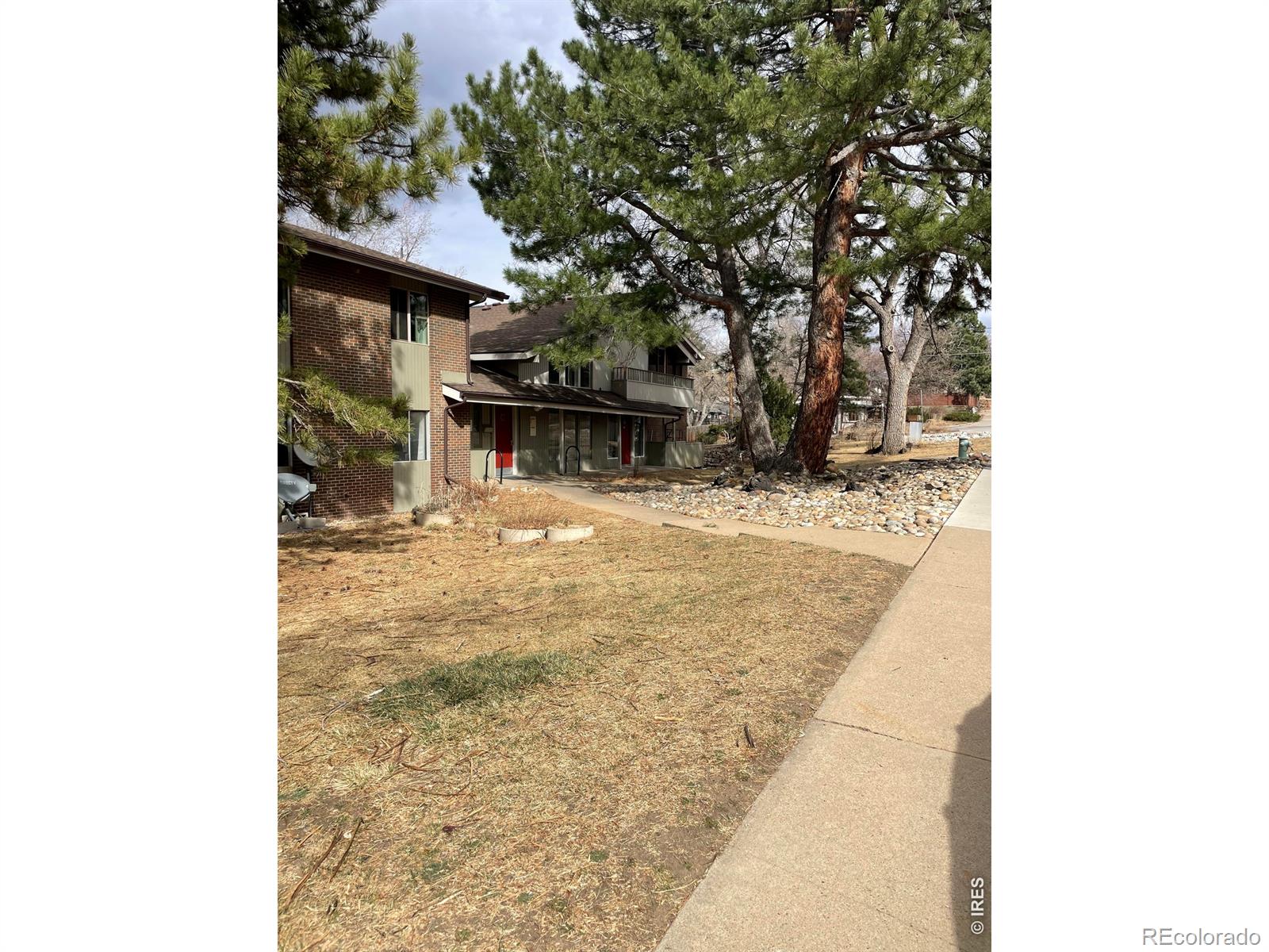 1895 Alpine Avenue, Unit G22 Boulder, CO 80304 - Photo 31 of 33 a view of a house with a yard