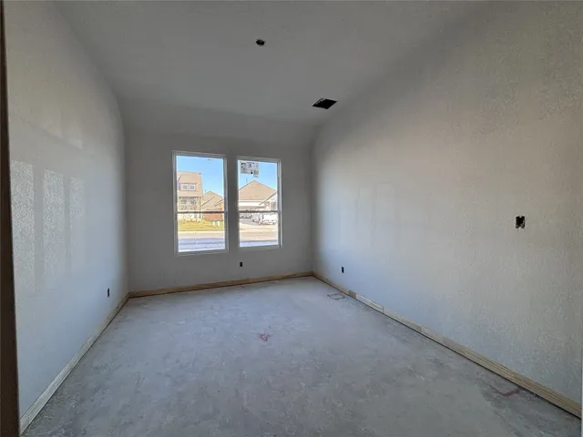 a room that has a bed and a window