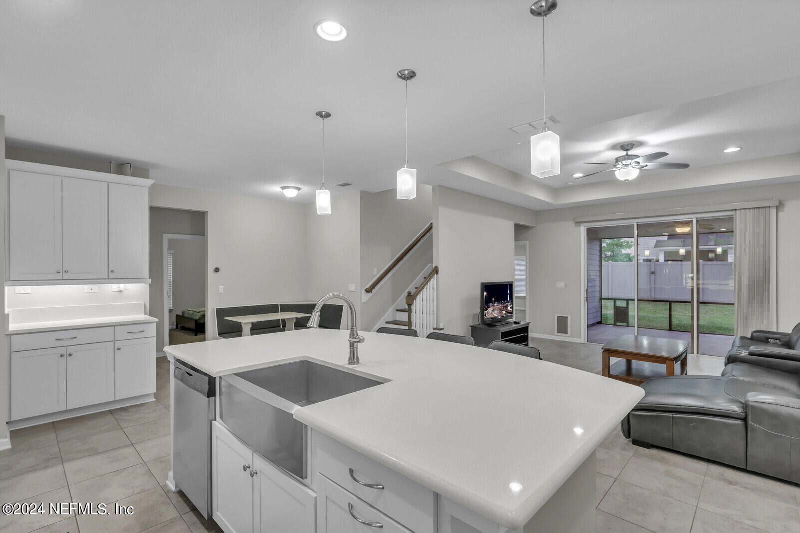 364 Beale Avenue St. Augustine, FL 32092 - Photo 11 of 54 a large white kitchen with a large window a sink and stainless steel appliances
