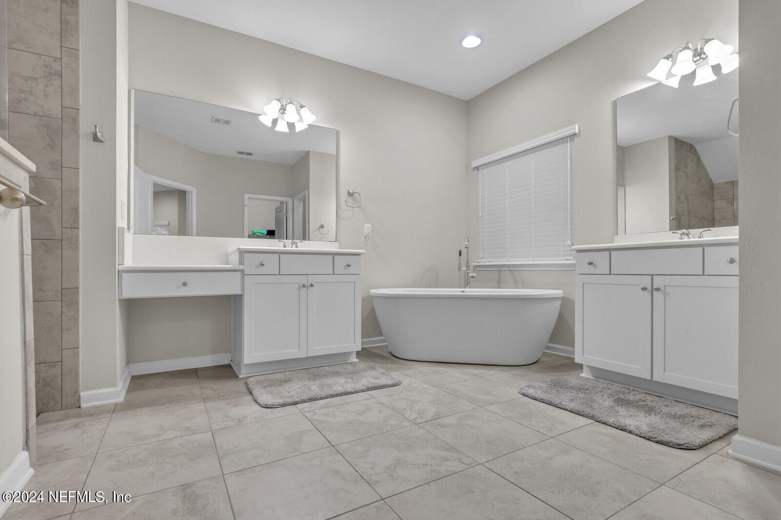 364 Beale Avenue St. Augustine, FL 32092 - Photo 20 of 54 a spacious bathroom with a tub sink and mirror