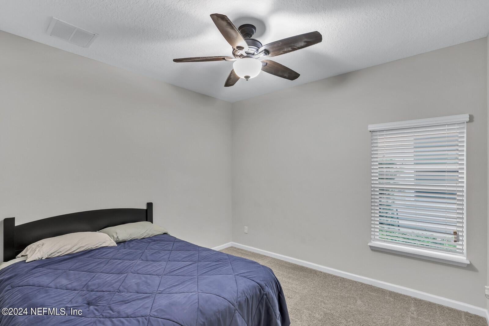 364 Beale Avenue St. Augustine, FL 32092 - Photo 22 of 54 a bedroom with a bed and a large window