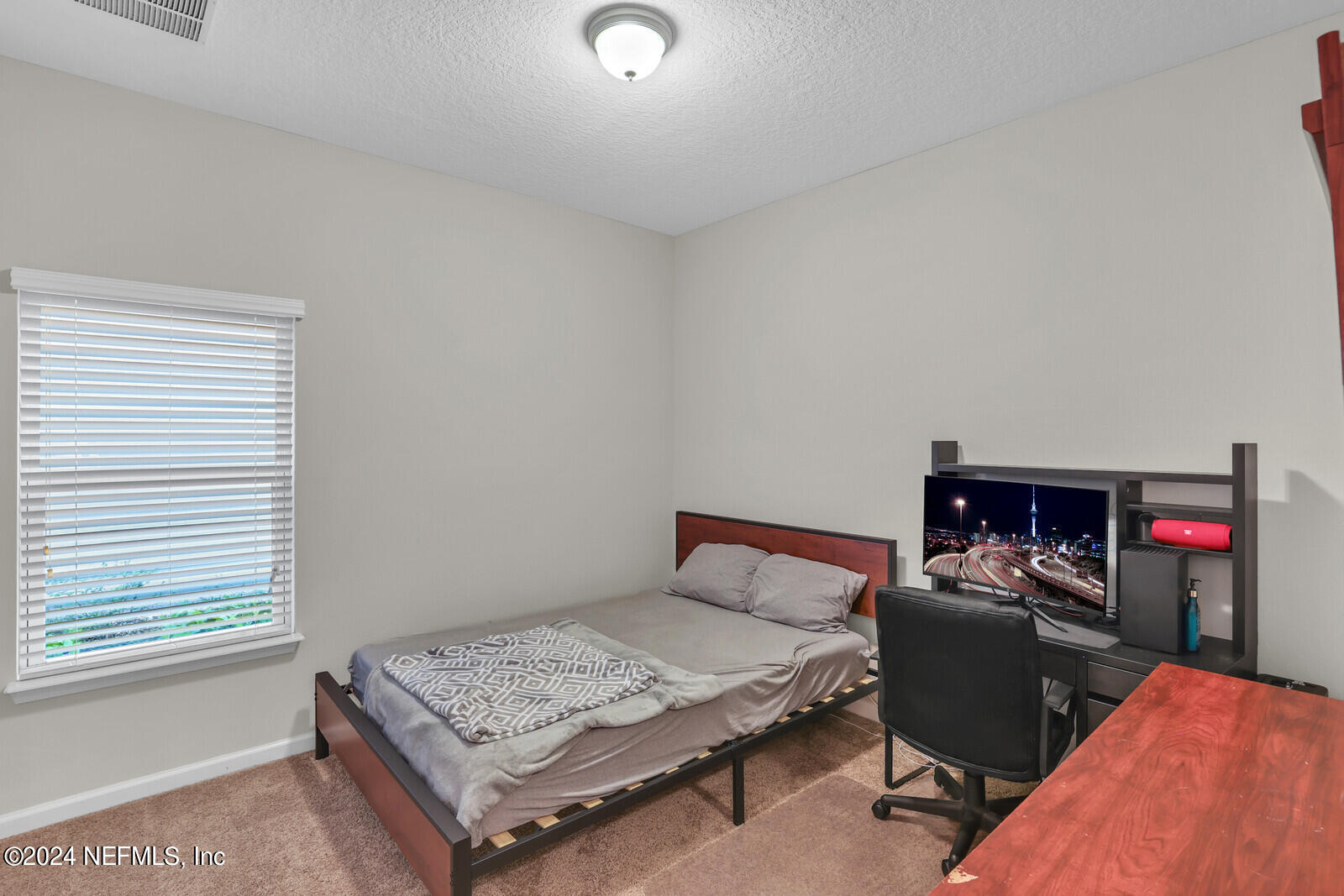 364 Beale Avenue St. Augustine, FL 32092 - Photo 23 of 54 a bedroom with a bed and a desk